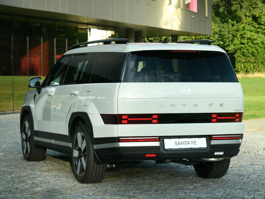 White Hyundai Santa Fe, a modern SUV, parked with its unique rear design visible, a legendary ugly car