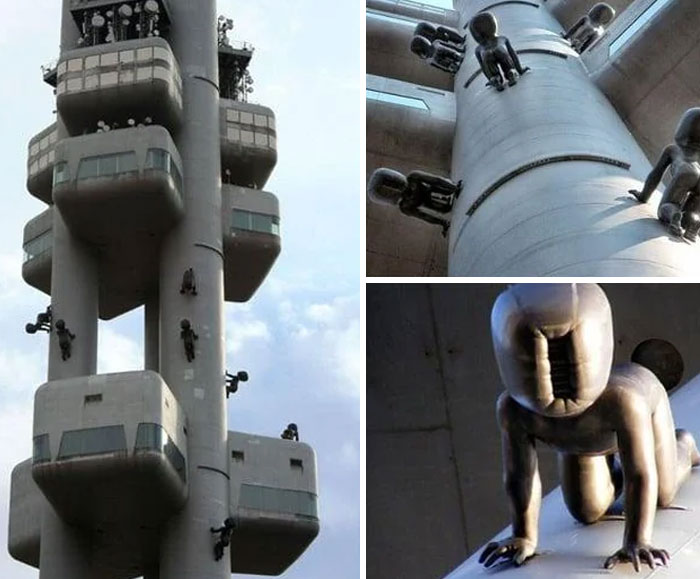 Tower with creepy crawling baby statues sculptures on pillars