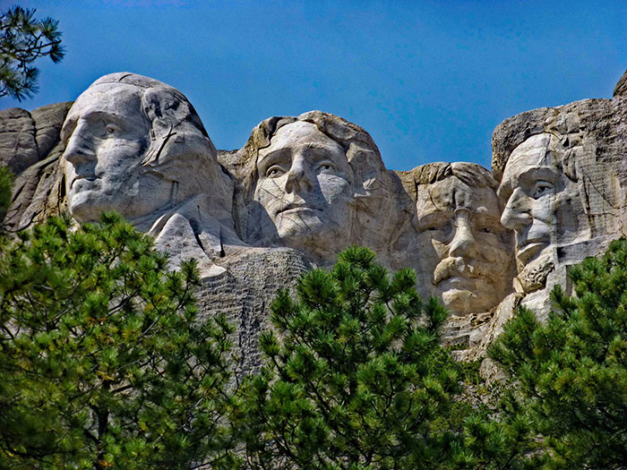 Mount Rushmore monument with four presidential faces carved in stone
