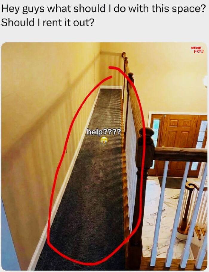 An architectural design fail, a narrow, unused carpeted strip along a staircase, posing a design challenge.