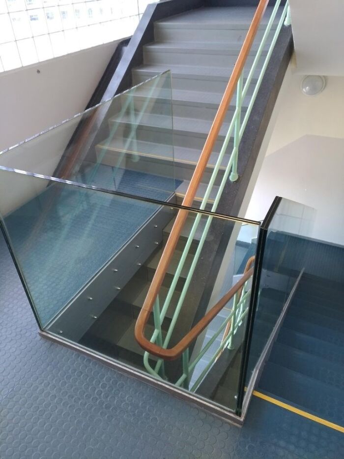 Stairs with a glass barrier blocking access, a clear architecture and design fail in building accessibility.