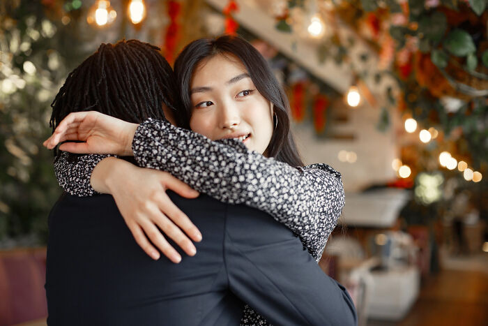 Couple hugging warmly in romantic relationship setting