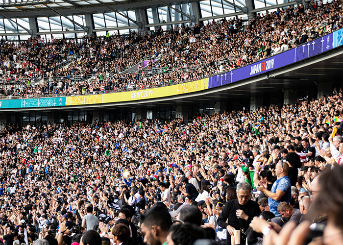 A stadium filled with World Cup fans, representing the environment of wealthy World Cup players.