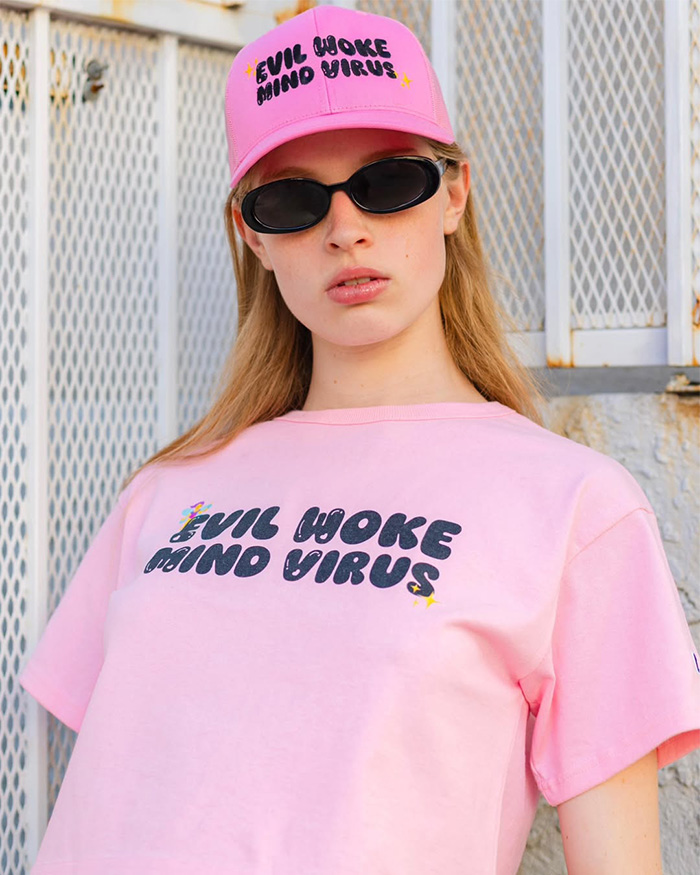 Vivian Musk wearing pink hat and t-shirt with slogan about woke culture Vivian Musk wearing pink hat and t-shirt with slogan about woke culture