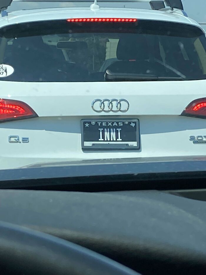 White Audi car with Texas license plate spelling INNI for online detectives