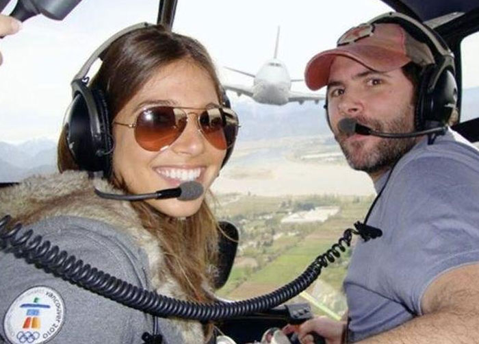 A couple in a helicopter with a large airplane in the background, a When You See It picture.