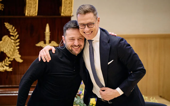 Two world leaders embracing and smiling showing wholesome leadership