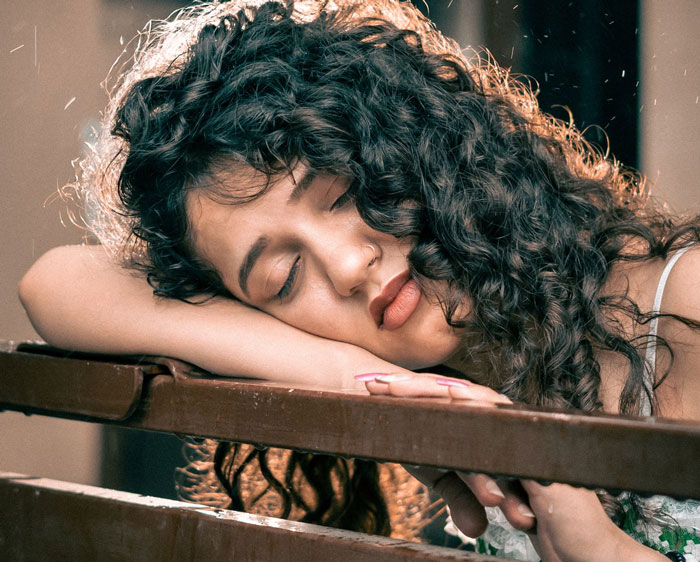 A pregnant woman asks husband for divorce, showing a woman with eyes closed, seemingly grieving. A pregnant woman asks husband for divorce, showing a woman with eyes closed, seemingly grieving.