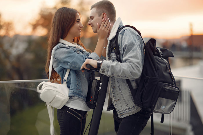 Couple sharing a tender moment outdoors at sunset, highlighting relationship and intimacy Couple sharing a tender moment outdoors at sunset, highlighting relationship and intimacy