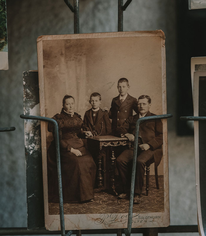 Old sepia toned family portrait photograph with parents and two children Old sepia toned family portrait photograph with parents and two children