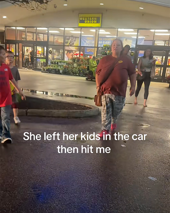 Woman walking outside store after kids left alone in hot car incident Woman walking outside store after kids left alone in hot car incident