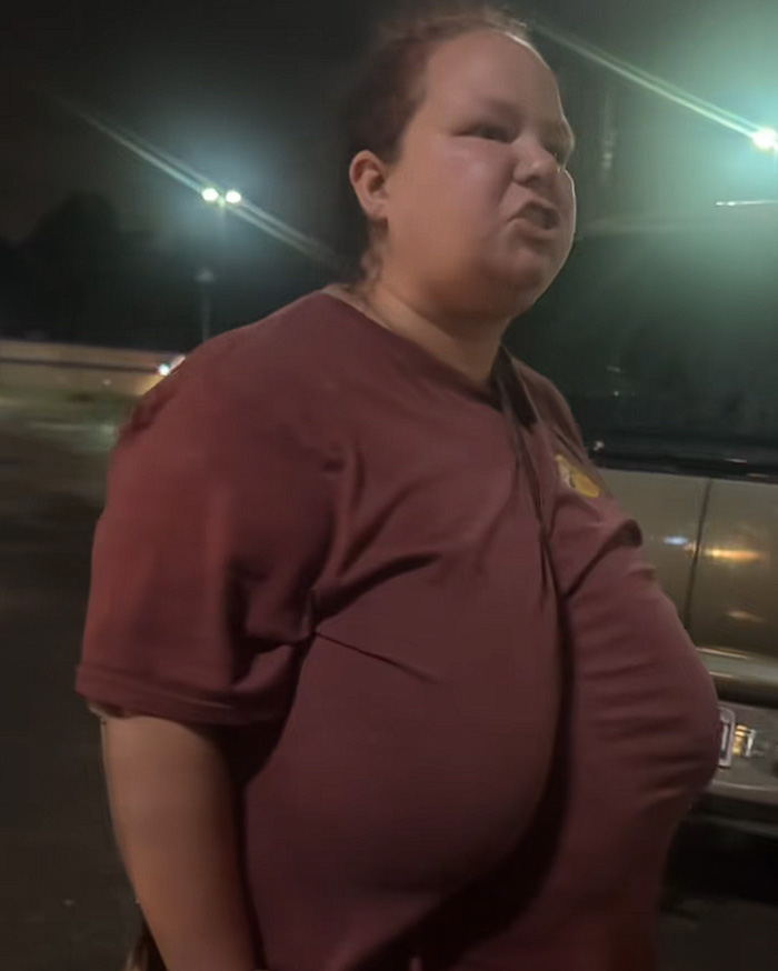 Woman in maroon shirt during confrontation about kids left in hot car Woman in maroon shirt during confrontation about kids left in hot car