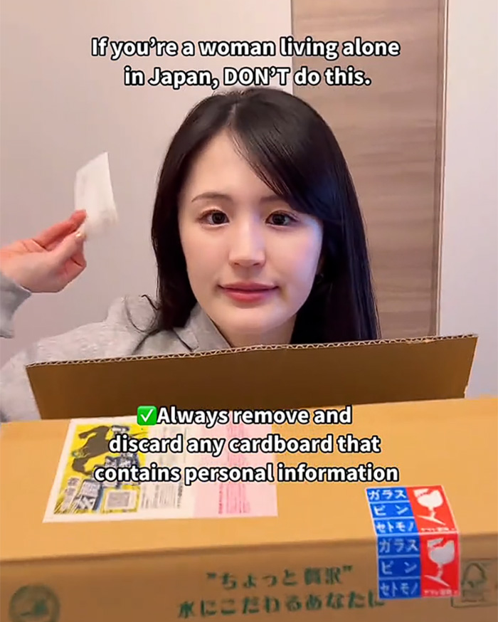 A woman living alone in Japan demonstrates removing personal info from a package to prevent issues. A woman living alone in Japan demonstrates removing personal info from a package to prevent issues.