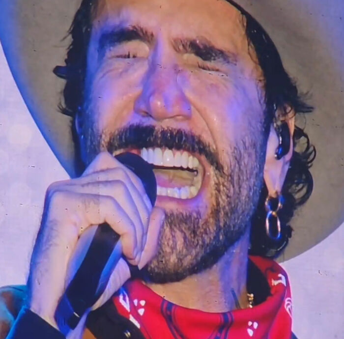 World Cup opening ceremony headline singer performing with hat and microphone