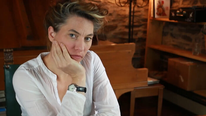Woman in casual white shirt reflecting on celebrity encounters
