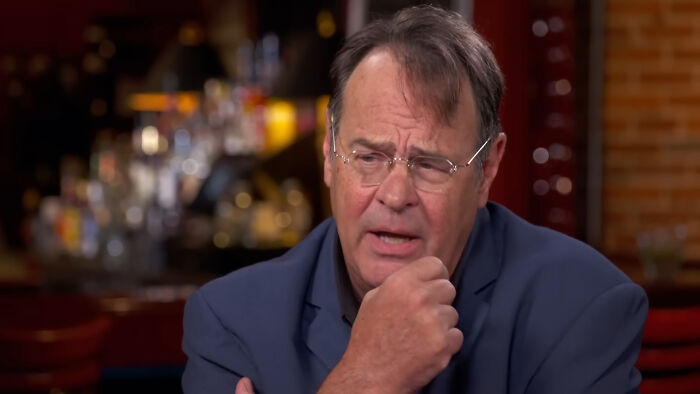 Man in glasses expressing emotion about disappointing celebrity encounters