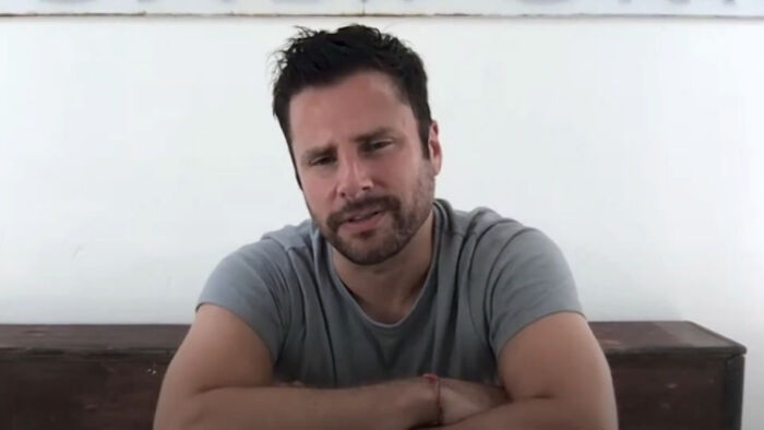 Casual celebrity man with beard speaking in a video about disappointing celebrity encounters
