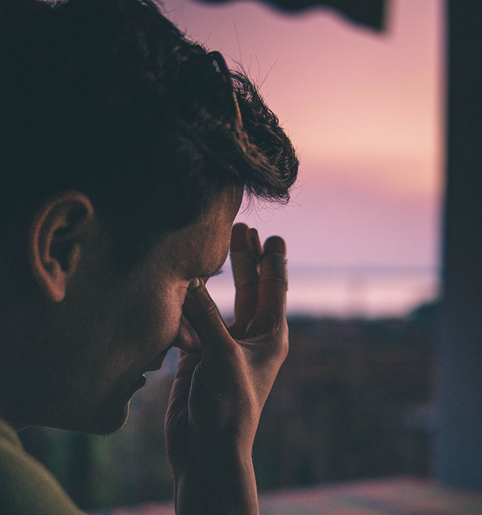 Man stressed and upset reflecting on friendship realization