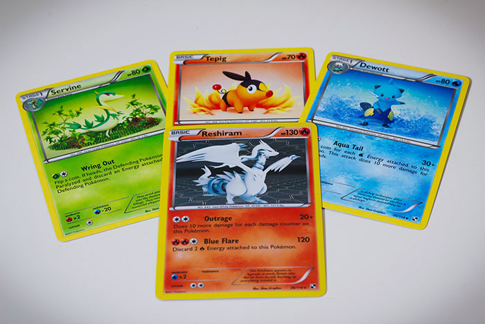Pokemon cards spread out unrelated to fake friend moments