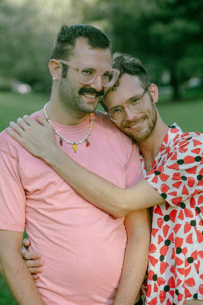 Happy couple embracing outdoors with class clown consequences theme