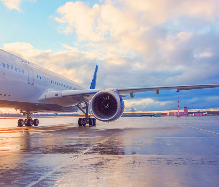 Airplane on a runway with cloudy sky, illustrating the issue of flights getting harder to handle and turbulence. Airplane on a runway with cloudy sky, illustrating the issue of flights getting harder to handle and turbulence.