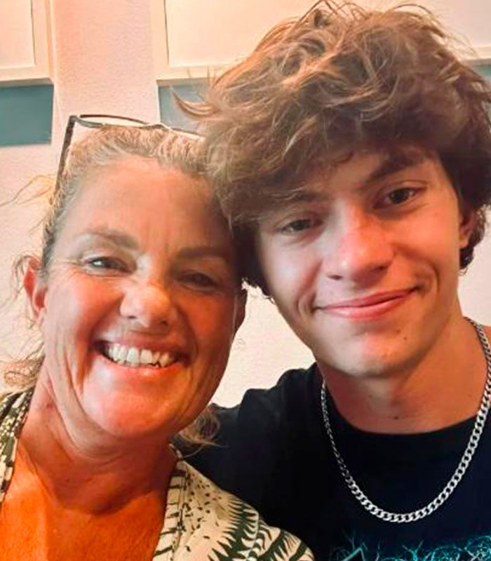 Mom and her teen son smiling. His mom breaks silence as he faces years in Thai jail over alleged airport crime.