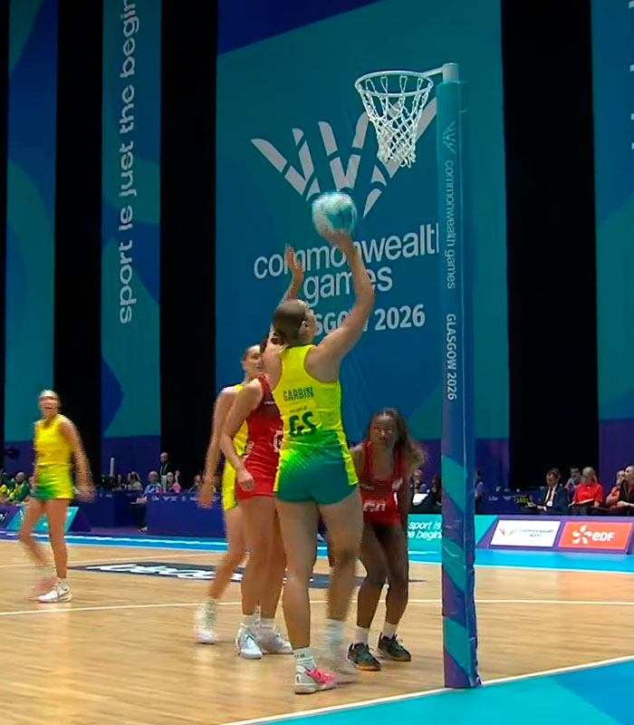 Female Australian team athlete playing netball at the Commonwealth Games, highlighting potential wardrobe fail.