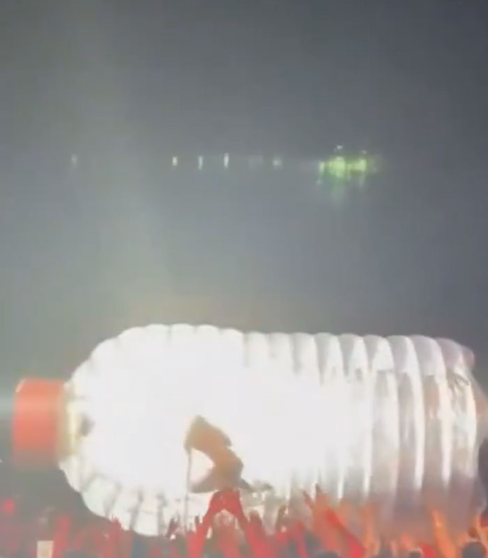 Katy Perry inside a giant plastic bottle as part of a bizarre stunt going wrong during a live show.