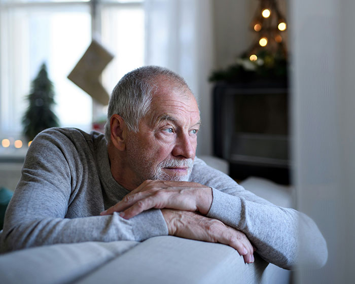 Senior man looking thoughtful, contemplating dementia and conditions that affect married people.