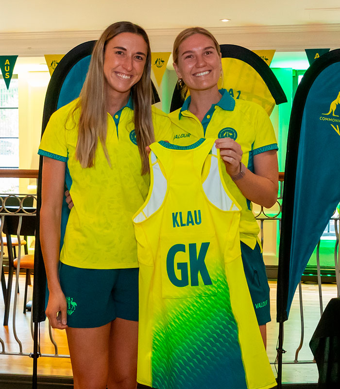 Female Australian team netball athletes posing with their uniform, related to the wardrobe fail at Commonwealth Games.