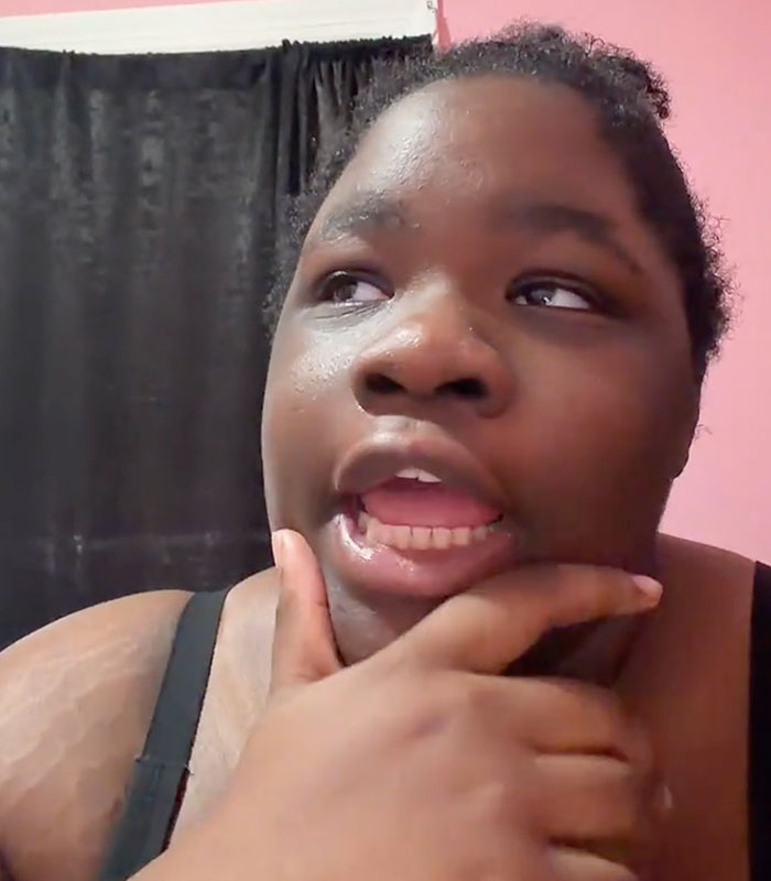 Close-up of a young woman thinking, sparking outrage with a video about giving up her baby to a stranger. Close-up of a young woman thinking, sparking outrage with a video about giving up her baby to a stranger.