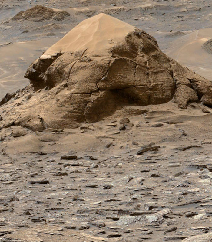 NASA Mars photo of a mystery object, a pyramid-like rock formation, on the red planet, suggesting a war theory. NASA Mars photo of a mystery object, a pyramid-like rock formation, on the red planet, suggesting a war theory.