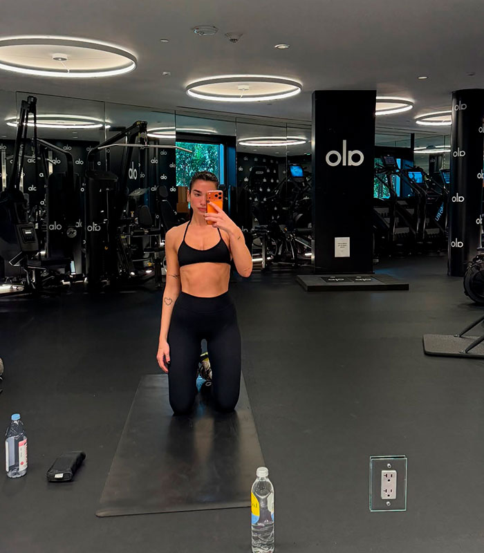 Dua Lipa in a gym, amidst discussions about the SkinnyTok trend and online trolls. Dua Lipa in a gym, amidst discussions about the SkinnyTok trend and online trolls.