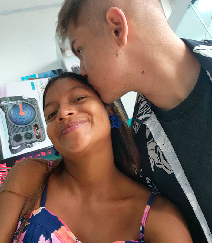 A man kissing an Amazonian woman on the forehead, depicting his love and life with a remote tribe. A man kissing an Amazonian woman on the forehead, depicting his love and life with a remote tribe.