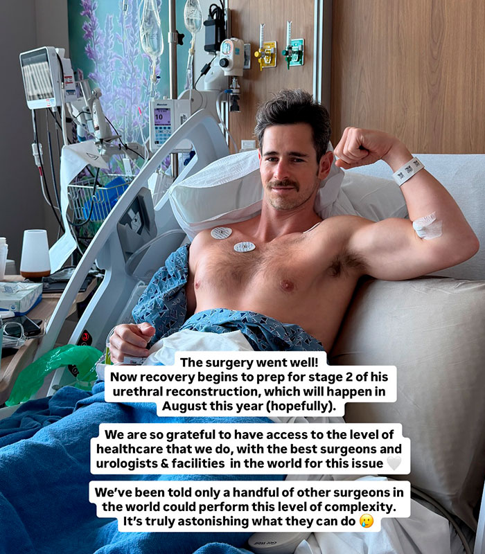 A man with hypospadias in a hospital bed post-surgery, showing his arm and expressing gratitude.