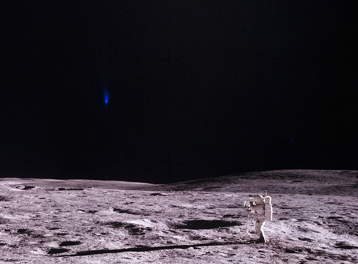 An astronaut on the moon with a mysterious blue light in the dark sky, central to claims about NASA photos hiding alien presence.