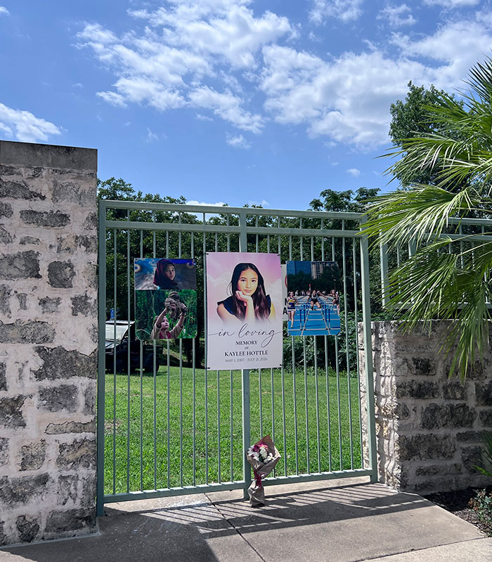 Memorial for Kaylee Hottle, Godzilla actress, on a gate with flowers, marking her fatal crash. Memorial for Kaylee Hottle, Godzilla actress, on a gate with flowers, marking her fatal crash.
