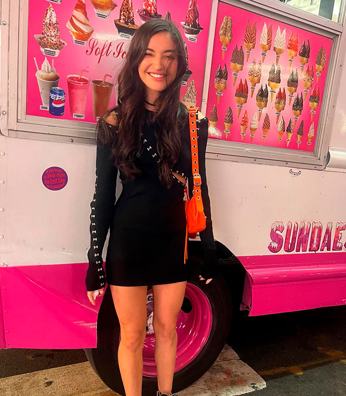 An adult star posing happily in front of an ice cream truck, despite the devastating tragedy leaving her permanently disabled. An adult star posing happily in front of an ice cream truck, despite the devastating tragedy leaving her permanently disabled.