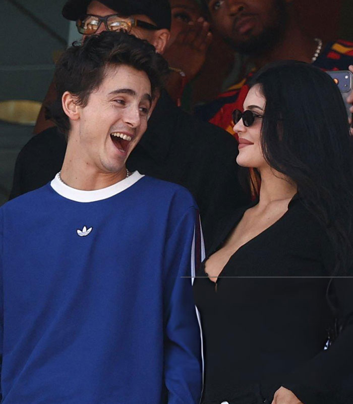 Kylie Jenner and Timothée Chalamet smiling and looking at each other during their World Cup appearance. Kylie Jenner and Timothée Chalamet smiling and looking at each other during their World Cup appearance.