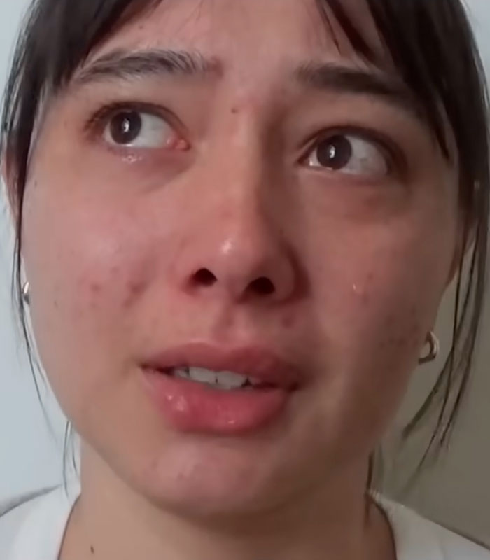 A close-up of a woman crying, reflecting the emotional impact of the Charles Manson discovery about her dad. A close-up of a woman crying, reflecting the emotional impact of the Charles Manson discovery about her dad.