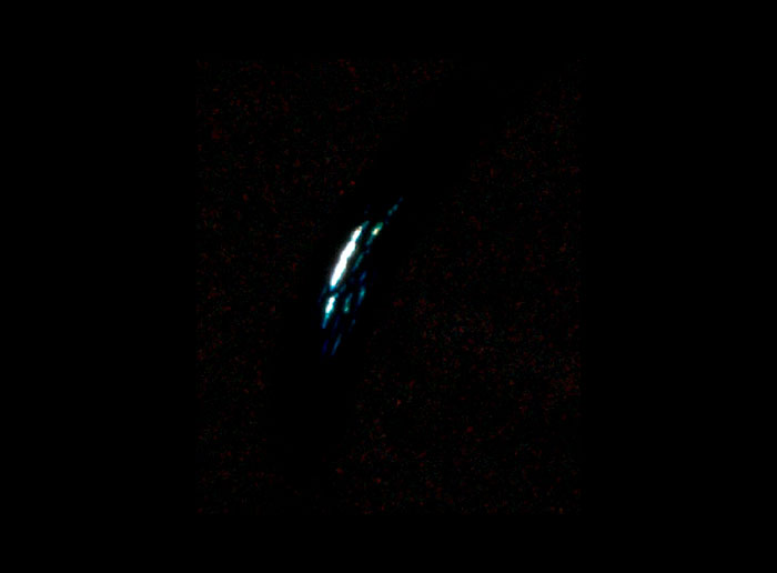 A blurry image on a black background, potentially showing an alien presence or edited NASA photos.