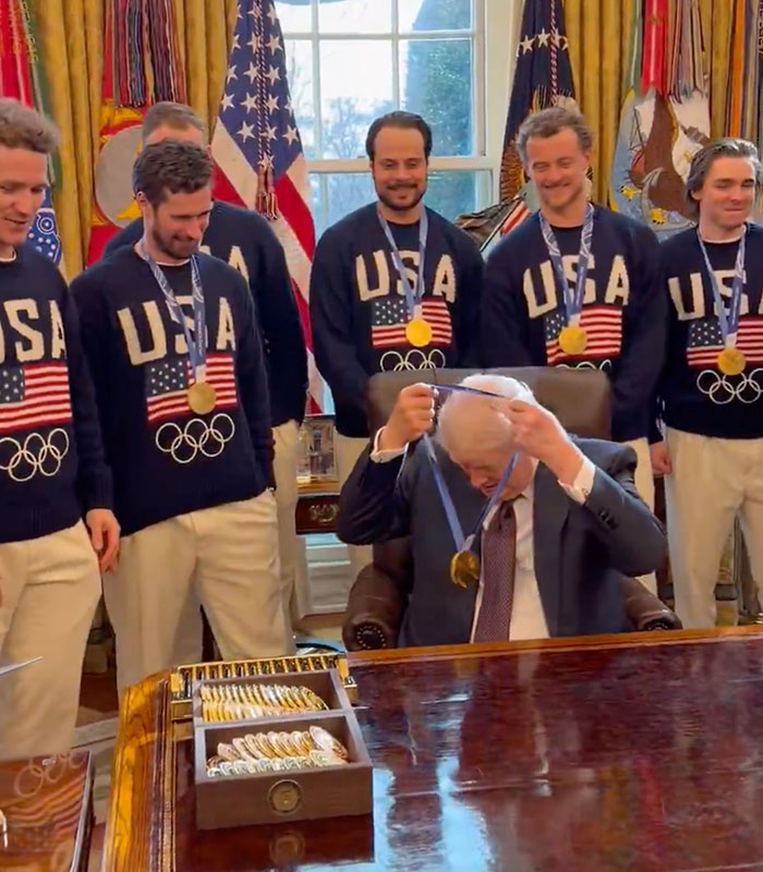 Kindergartener Trump holding an award he didn't win, surrounded by athletes with medals. Kindergartener Trump holding an award he didn't win, surrounded by athletes with medals.