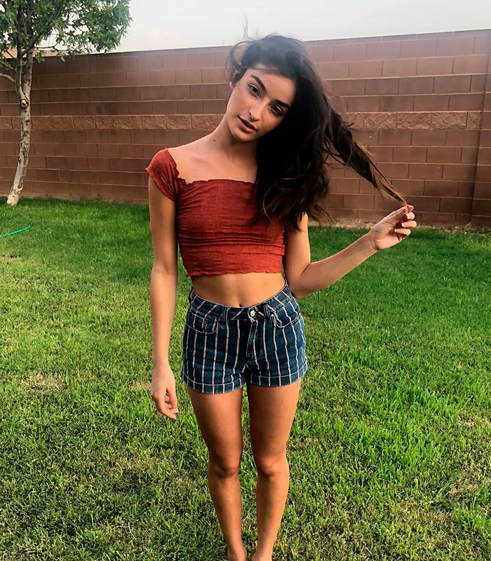 An adult star standing in a grassy backyard, showing resilience after the devastating tragedy left her permanently disabled. An adult star standing in a grassy backyard, showing resilience after the devastating tragedy left her permanently disabled.