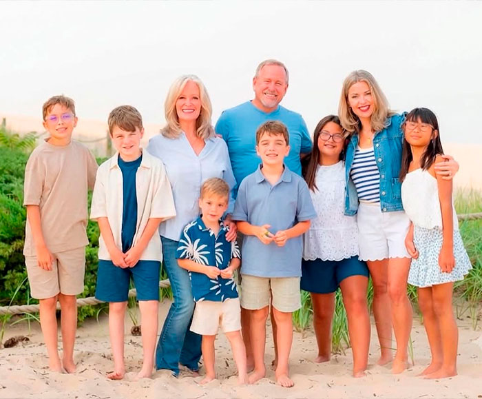 Grieving father and family including many children on a beach, silence on son-in-law's actions. Grieving father and family including many children on a beach, silence on son-in-law's actions.