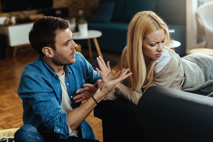 Distraught man expressing frustration to his cheating wife who refuses to cut contact with her other man. Distraught man expressing frustration to his cheating wife who refuses to cut contact with her other man.