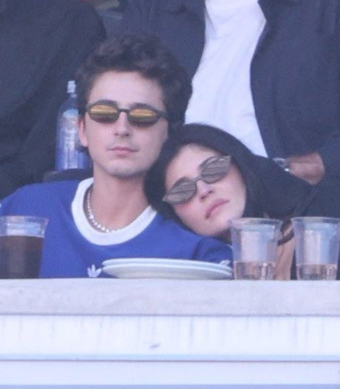 Kylie Jenner leaning on Timothée Chalamet, both wearing sunglasses, during their World Cup appearance. Kylie Jenner leaning on Timothée Chalamet, both wearing sunglasses, during their World Cup appearance.