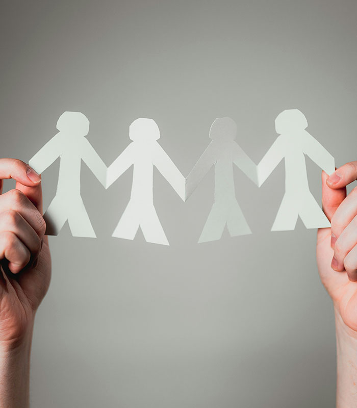 Paper doll chain held by two hands, symbolizing the act of giving up a baby to a stranger. Paper doll chain held by two hands, symbolizing the act of giving up a baby to a stranger.