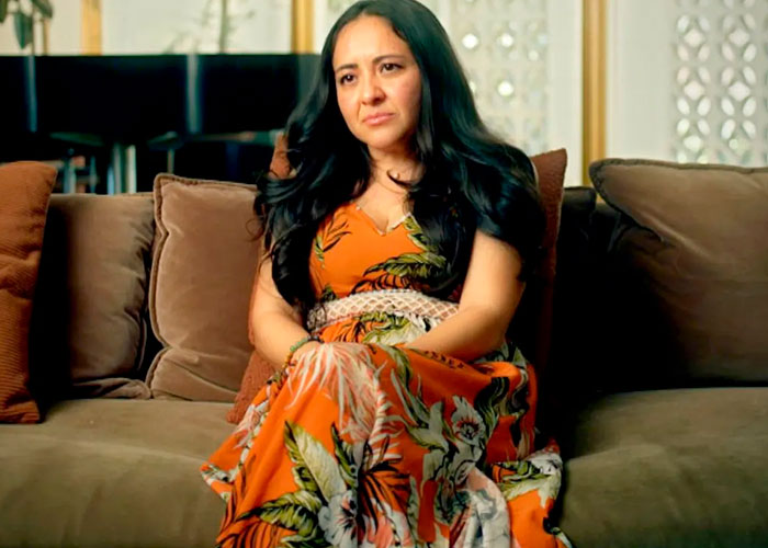 Woman in an orange dress on a couch, among four women slamming Jared Leto with new allegations. Woman in an orange dress on a couch, among four women slamming Jared Leto with new allegations.