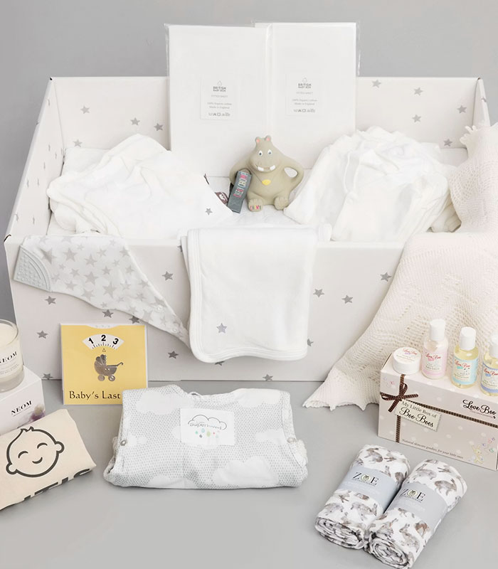 Box filled with various baby items, reflecting the theme of giving up her baby to a stranger. Box filled with various baby items, reflecting the theme of giving up her baby to a stranger.
