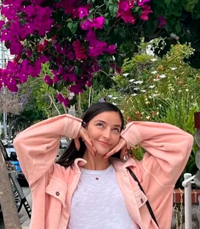 Adult star's mom gives health update after devastating tragedy, showing her daughter smiling under purple flowers. Adult star's mom gives health update after devastating tragedy, showing her daughter smiling under purple flowers.